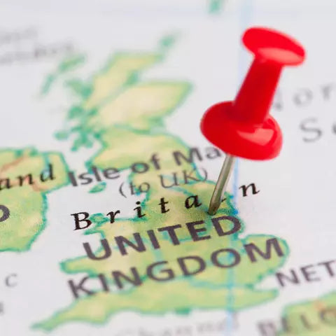 map of the UK with a push pin in it